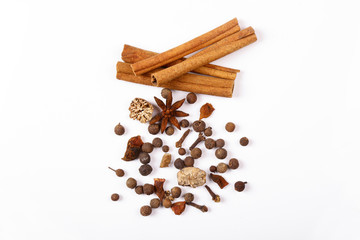 Spices for mulled wine. Spices for mulled wine isolated white background. Cinnamon sticks, roast pepper, ginger, tubberry, nutmeg, cardamom, cloves.