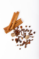 Spices for mulled wine. Spices for mulled wine isolated white background. Cinnamon sticks, roast pepper, ginger, tubberry, nutmeg, cardamom, cloves.