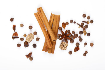 Spices for mulled wine. Spices for mulled wine isolated white background. Cinnamon sticks, roast pepper, ginger, tubberry, nutmeg, cardamom, cloves.