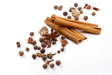 Spices for mulled wine. Spices for mulled wine isolated white background. Cinnamon sticks, roast pepper, ginger, tubberry, nutmeg, cardamom, cloves.