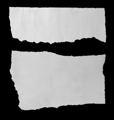 Torn papers on black