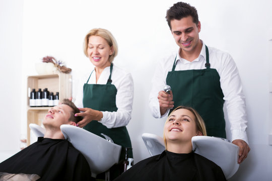 Customers and hairstylers washing hair