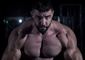 Fototapeta premium Muscle Man in the Gym