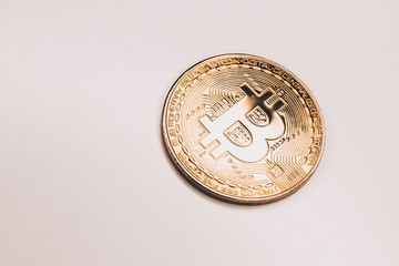 Bitcoin gold coin on pink