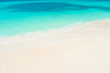 Beach with white sand, clear blue water in antigua