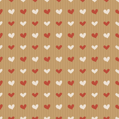 Vector seamless pattern of craft paper with colorful hearts. Valentine's Day background