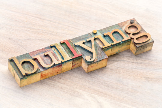 bullying word abstract in wood type