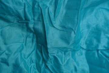 зелёная мятая текстура ткани из куска одежды © butus