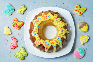 Easter Bundt cake with colorful topping and Easter Cookies
