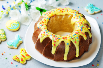 Easter Bundt cake with colorful topping and Easter Cookies