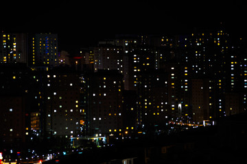 Massive aparments view during the night time with its electric lights