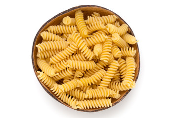 Uncooked fusilli pasta isolated white background.