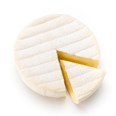Piece of camembert cheese isolated on white background. From top view. - obrazy, fototapety, plakaty