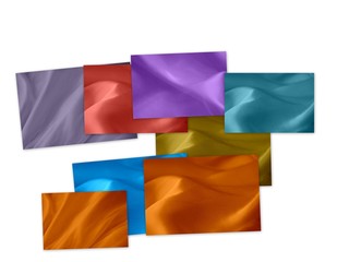 Set of multicolored silk fragments on a white background
