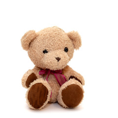 Teddy bear with a red bow on her neck on an isolated background