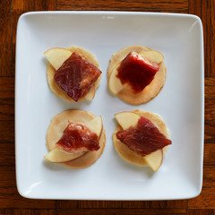 Wild-caught, smoked Chinook salmon on apple slices and crackers.