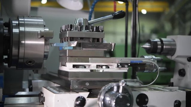 Metal Lathe Machinery Closeup Video. Metal Processing by Caucasian Worker Machine Operator