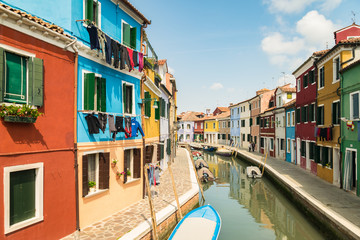 Naklejka na ściany i meble Colorful houses by canal in Burano, Venice, Italy.