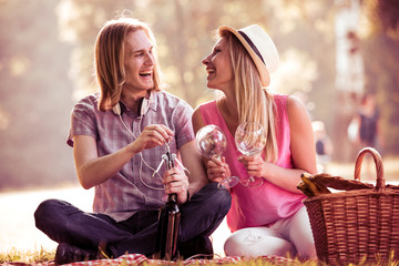 Young couple drinking wine.