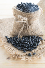 Fototapeta na wymiar black-beans in hemp sack