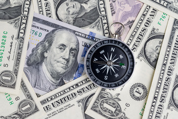 Direction of United States financial concept, compass on US Dollar banknotes using as leadership of country guidance after government shutdown