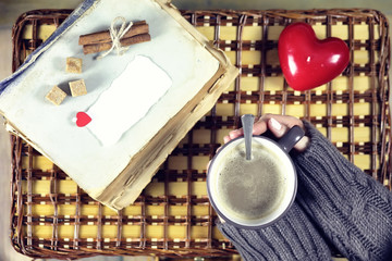 woman drinking coffee and looking at the card Valentine's Day