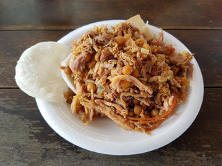 lechona dish typical from epsinal, colobmai with rice and pork