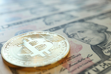 Bitcoin on US Dollars Bill, Concept for Cryptocurrency