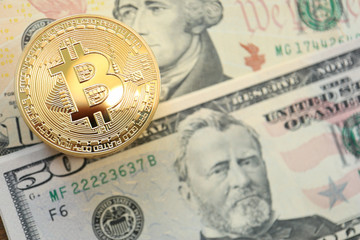 Bitcoin on US Dollars Bill, Concept for Cryptocurrency