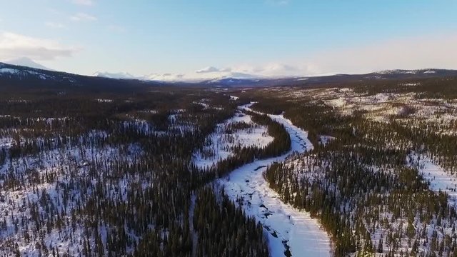 Aerial video of mountains and river.