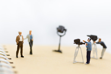 Miniature people : Small team of tv reporter with Celebrity Interviews, production television concept.