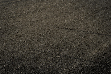 Black asphalt road textured background.