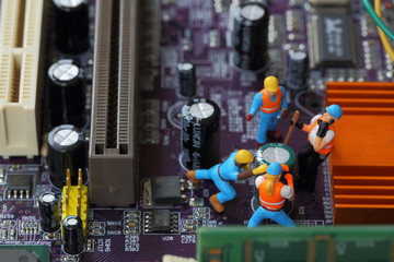 Selective focus of miniature engineer and worker fixed and  mainboard computer and use for business...