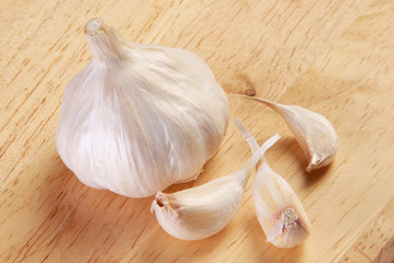 Garlic on wood board closeup    