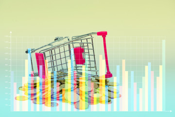 Double exposure Stack of coins and shopping cart or supermarket trolley with financial graph, business finance concept.