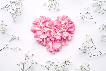 Heart shape made of flowers on white background.Flat lay. Valentines,love and wedding concept .