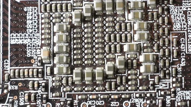 Computer circuit board close up, electronic technology background.
Electronic components on a computer board.

