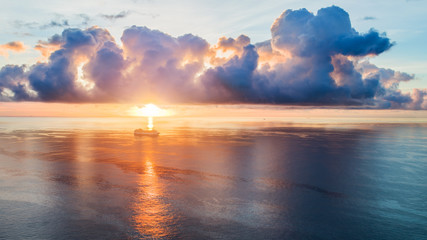 small seagoing ships floating off coast resort