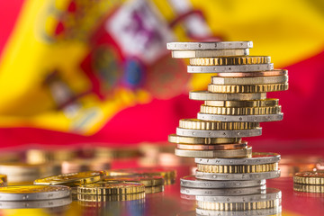 National flag of spain and euro coins - concept. Euro coins. Euro money. Euro currency
