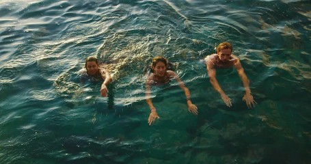 Friend relaxing swimming in the ocean - Powered by Adobe