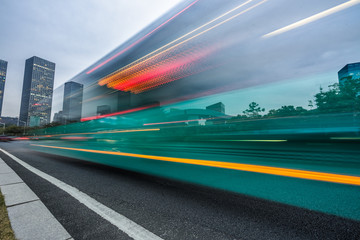 urban street with motion bus at twilight, china