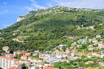 Daylight sunny view to city buildings on top of the mountain and