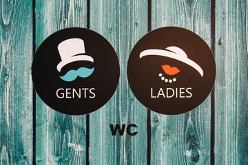 Vintage wc signs on wooden green door - Powered by Adobe