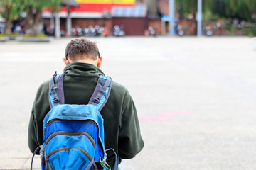 man traveler with backpack. soft-focus and over light in the background