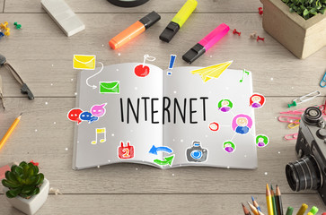 Open booklet and office tools on the floor