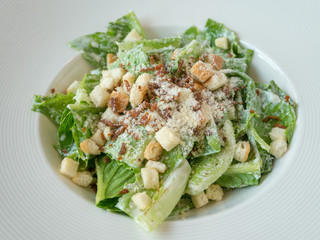 Caesar salad on wood table
