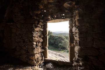 View through door of Troglodyte house at Ostriconi in Corsica