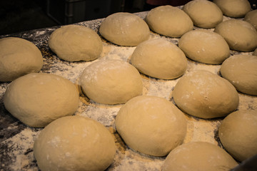 Fototapeta na wymiar Bread ball dough on the tray in row
