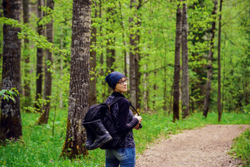 Naklejka premium Beautiful young girl with a backpack in the tourism campaign