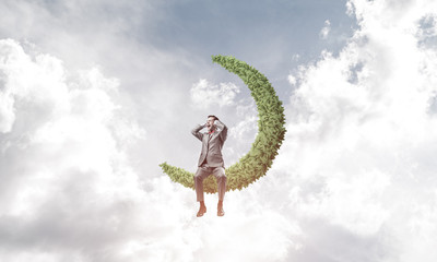 Young man in sky on moon do not want to hear anything
